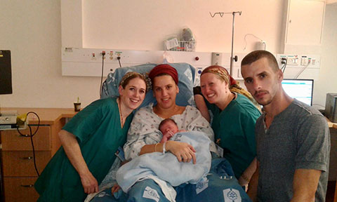 Nurse takes little boy’s blood pressure-Arab Mom and Dad look on